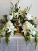 White Orchids & Lilies Surround (shown at $300.00)